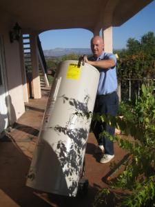 Daly City CA plumbing technician installs a water heater