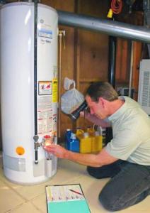 plumber in daily city diagnoses broken water heater to begin a repair